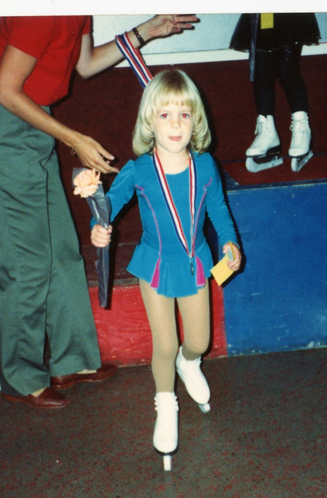 Melissa (Taylor) Duncan getting a medal after skating